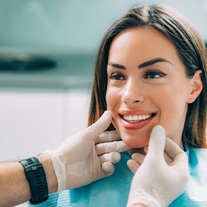 Dentist examining his patient’s teeth