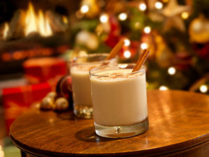 Two glasses of eggnog on small table